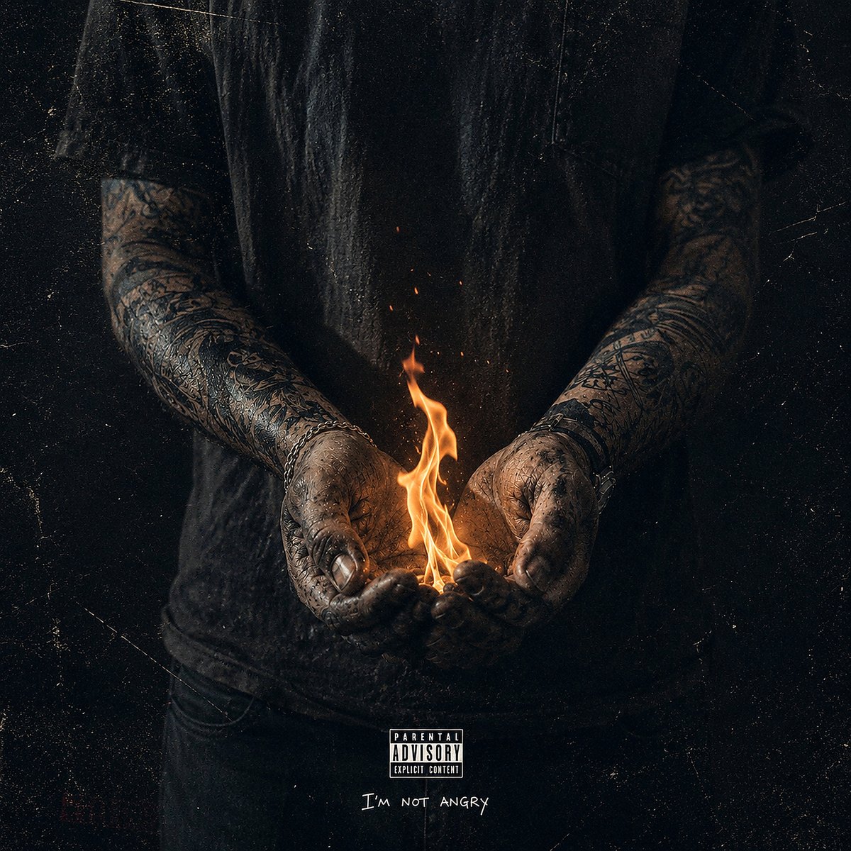 I'm Not Angry cover art: tattooed hands cupping a small flame