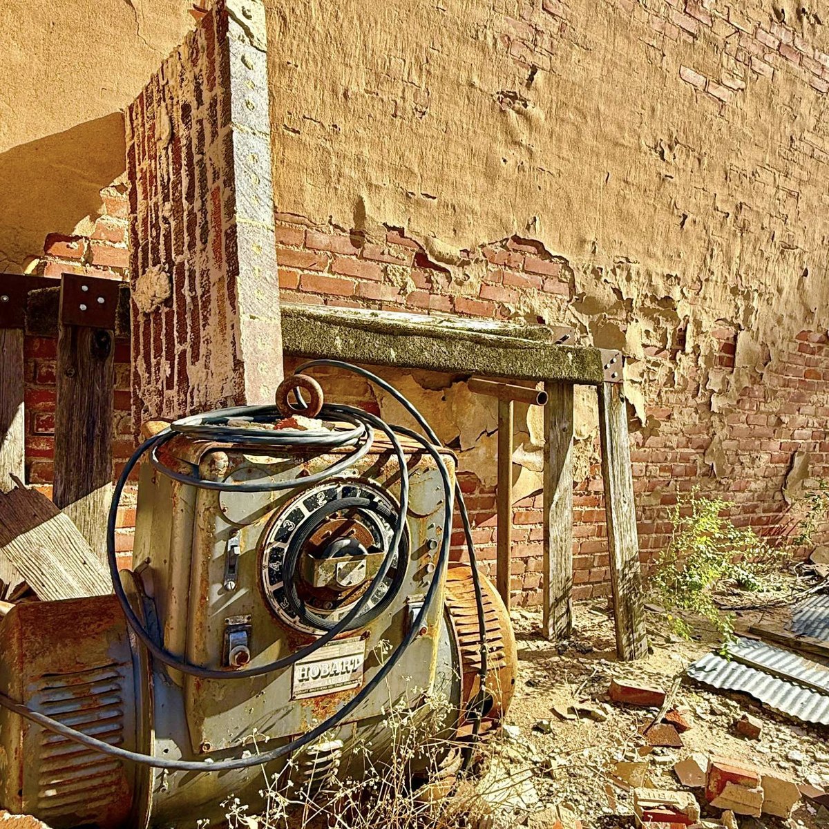 That Is What You Do cover art: a rusted Hobart welder against a crumbling brick wall